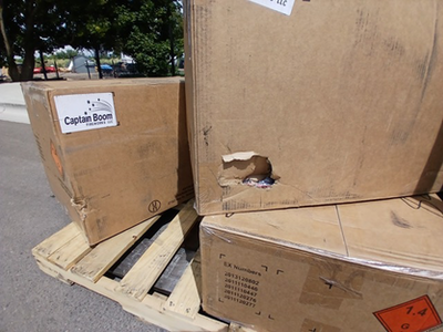 Image of fireworks boxes damaged by the freight company during delivery.
